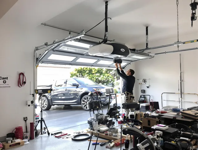 Fountain Garage Door Repair specialist installing smart garage door opener system in Fountain home