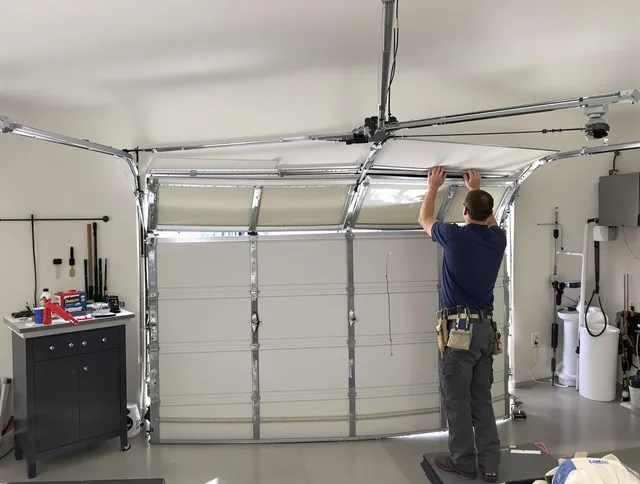Fountain Garage Door Repair specialist performing precise section replacement on Fountain garage door
