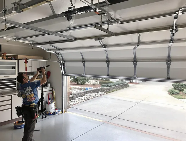 Garage door track repair service by Fountain Garage Door Repair in Fountain